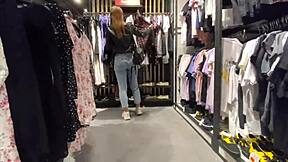 The girl completes the purchase in the locker room