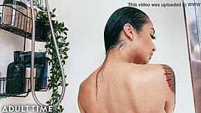 This Asian beauty fingers herself in the steamy shower. Her petite frame captivates under the water.