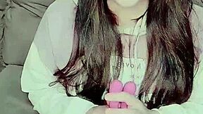 A curious girl explores self-pleasure with a bunny toy, feeling relaxed and intrigued.