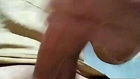 I'm masturbating in the bathroom at my job, feeling horny and reaching orgasm with my cock