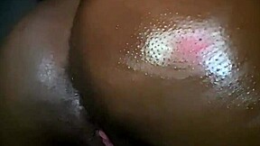 ebony teen oils up her ass and fingers her wet pussy on webcam