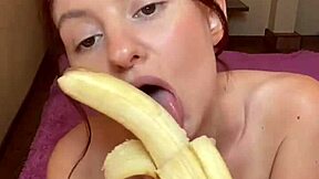 Watch this hot brunette suck on a banana