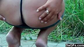 Couple makes video while girlfriend teases boyfriend outdoors in miniskirt.