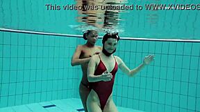 Enjoying steamy lesbian sex underwater, teenage couple