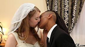 The ebony lesbian fucked her wife with a strap-on on the bed