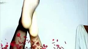 Watch this young girl give a footjob massage