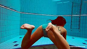 Is Deniska, the Big Tits Petite Babe, Swimming in the Pool for Underwater Fun?