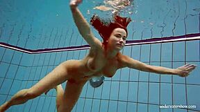 Is Deniska, the Big Tits Petite Babe, Swimming in the Pool for Underwater Fun?