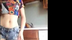 Teen strips seductively on webcam, dancing with clothes ripped at home