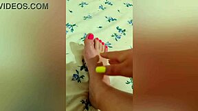 young babe stroking her sexy feet with pink pedicure?