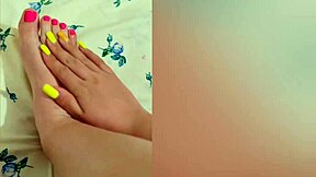 young babe stroking her sexy feet with pink pedicure?