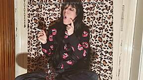 the skinny goth girl smokes backstage after a long day