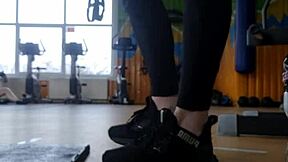 In the gym, a young british female shakes her ass seductively