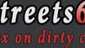 anya is bent over in bondage for spanking in a rough outdoor public setting with domination elements.