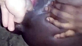 Young ebony teen fingers her wet pussy open