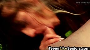 Pretty brunette teen sucks and rides old guy's cock outdoors in casual encounter.