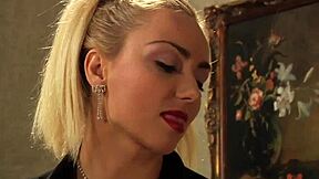 tied submissive lesbian slave reaches orgasm from deep fingering.