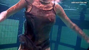 i watch katya okuneva bouncing her titss in a dress at the pool partyy