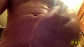 Alone at home, a young teen masturbates with big cock in hand