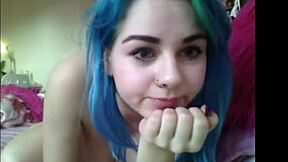 Look at this blue-haired teen 18+ flashing her huge pierced tits on webcam, don't you want to see more?
