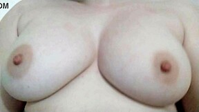 she plays with her big natural tits in the bathroom, teasing in slow motion.