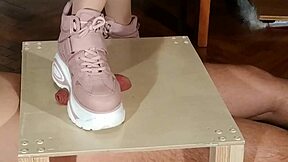 Goth domina in pink boots humiliates slave with cock stomping