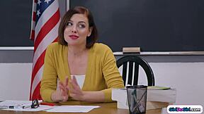 Teacher helps 19yo stepteen in classroom lesson.