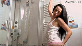 Petite Russian brunette babe in bikini uses dildo in shower, cumming hard.