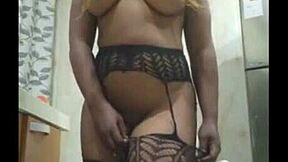 the attractive african girl shows off her beautiful body in stockings and pantyhose at home