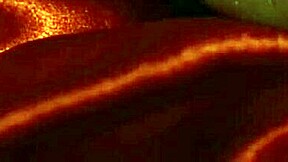 Sexy devil drips hot wax over her big clit and sensitive nipples.