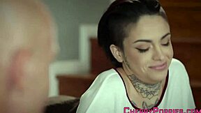 The tattooed teen eagerly sucks the big cock before riding it passionately.