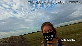 juli smith meow slowly undresses in the outdoor field for voyeurs