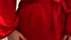 brunette in red lingerie teases with her big assets.