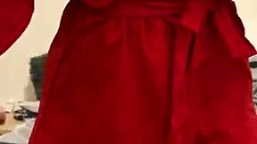 brunette in red lingerie teases with her big assets.