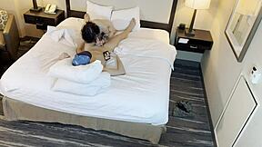 The tattooed beauty is giving a blowjob to her partner.