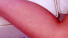 captivating blonde, explore your sexy figure on the sofa?