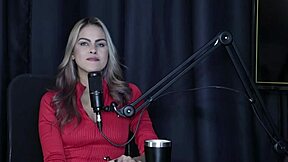 Sofie Lollipop teases with sheer red lingerie, kisses presenter, and shows blowjob skills in group fun 😏