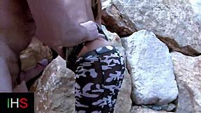 dirty guy bangs a sexy brunette in the ass on the beach