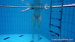 Sexy teen flaunts stunning body in underwater display