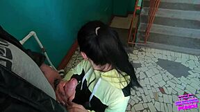 Risky public blowjob on staircase with eager friend