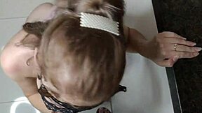 Stepdaughter slurps huge cock, face drenched in kitchen