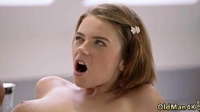 Old man seduces young brunette girl in steamy bathroom encounter.