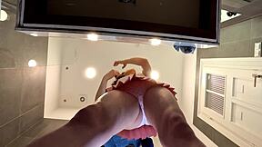 why is this braless brunette showing her ass in the bathroom?