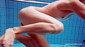 Martina shows off her blue bikini underwater