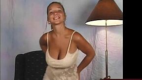 Big tits shake in beige dress while dancing
