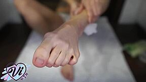 Look at this brunette showing her oiled feet in close-up foot fetish!