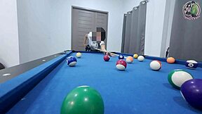 thai girl in uniform climbs pool table for fun game in dorm