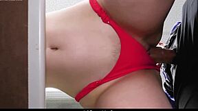 The loss prevention officer catches the suspect and escorts her to the backroom.