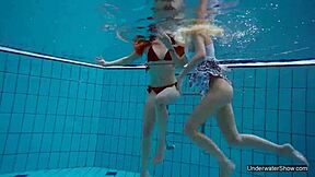 two hot lesbians splashing in the pool 😍