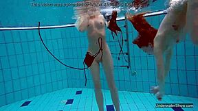 two hot lesbians splashing in the pool 😍